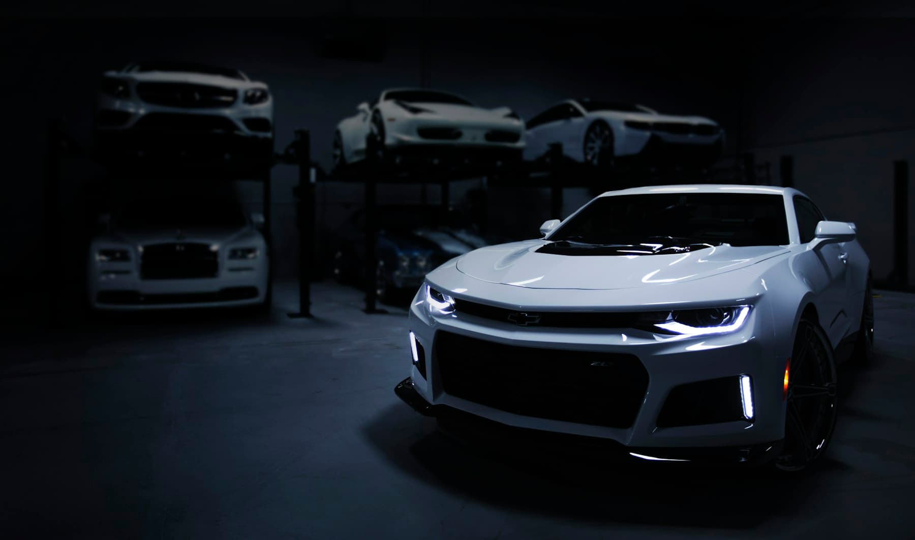 Dark coupe with reflective paint. Demonstration photograph. Not verified work from this shop.